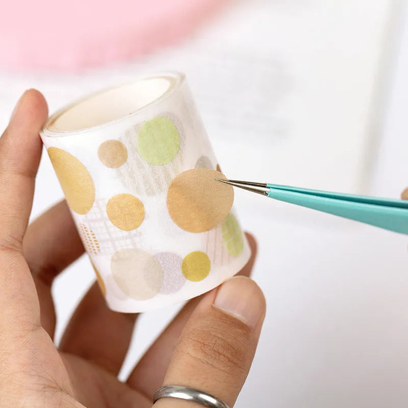 Stainless steel macaron-coloured tweezers in blue, green, and pink with straight and elbow tip styles on paper card packaging