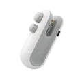 White handheld vacuum sealing machine with magnetic back and cutter blade for chip bags