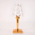 Rose gold portable touch control night light on a surface.