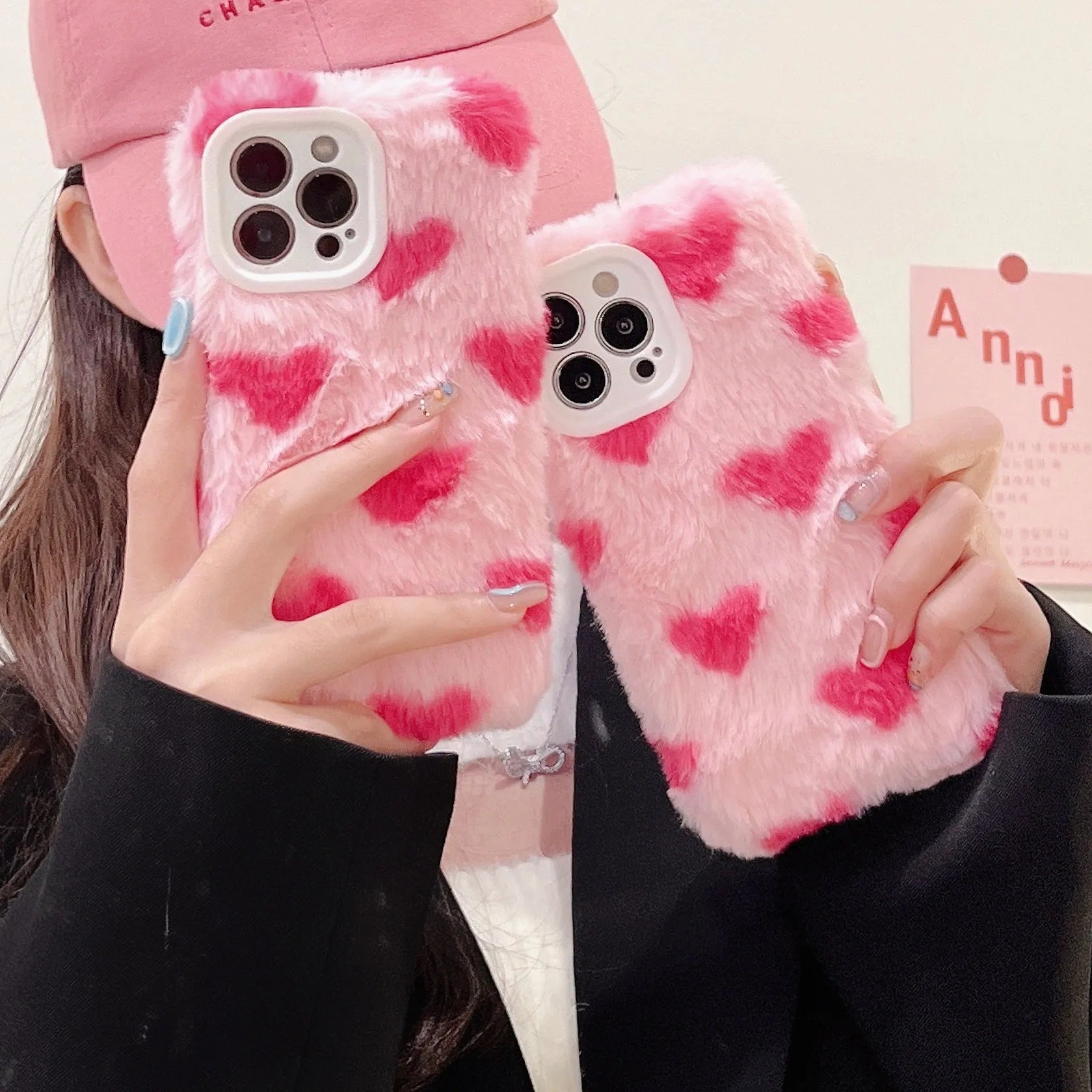 Pink silicone phone case with a cartoon design, shown fitted on an Apple iPhone.