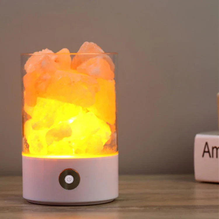 Himalayan salt lamp with natural pink-orange glow, releasing negative ions to purify the air and create a calming, relaxing atmosphere