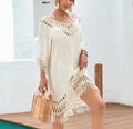 Apricot crocheted patchwork knitted dress with half sleeves on a person.