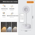 Modern geometric rechargeable wireless wall lamp in white with remote control on a grey wall.