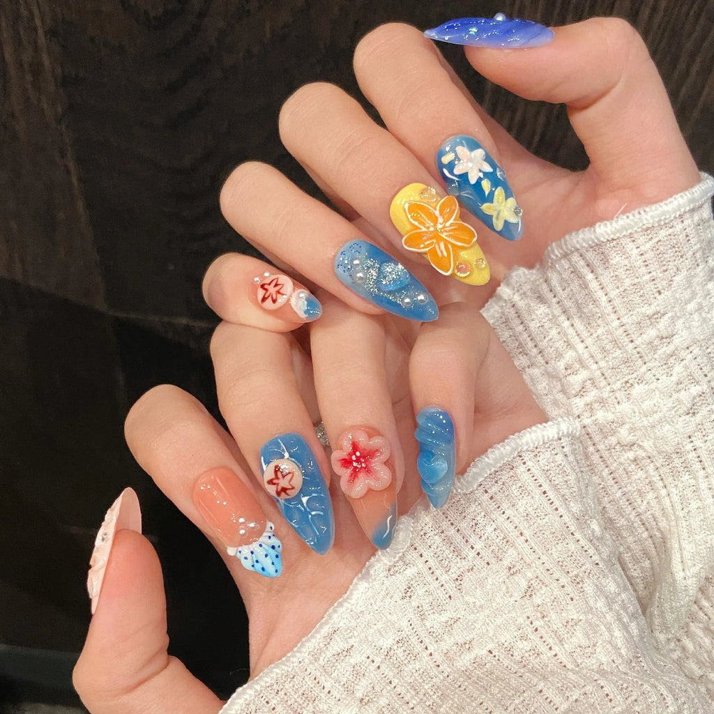 Three-dimensional carved jellyfish marine style plastic wearable armour in almond nail colour with rose, tulip, and XINGX patterns