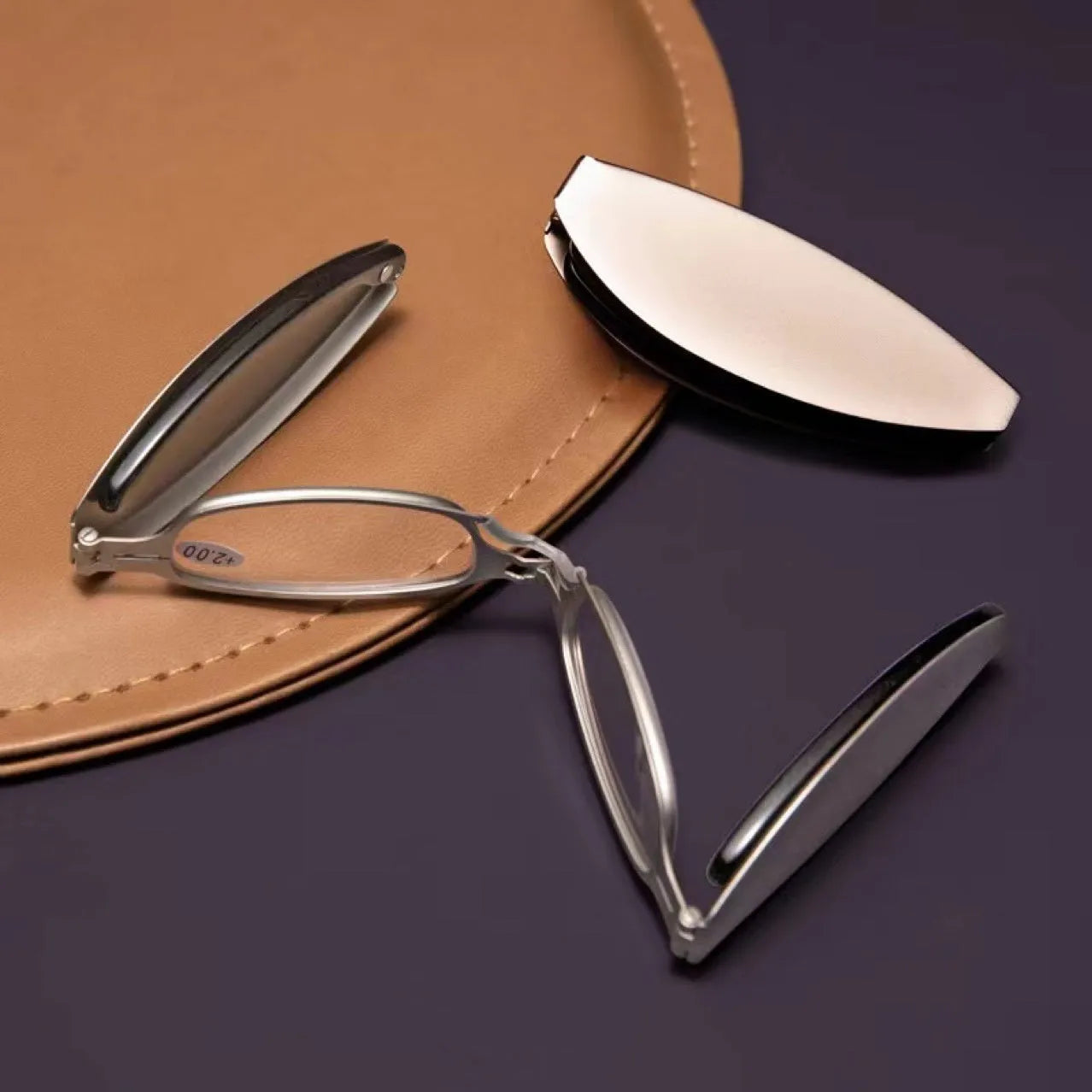 Black folding presbyopic glasses with retro frame and ring detailing, shown in open and closed positions