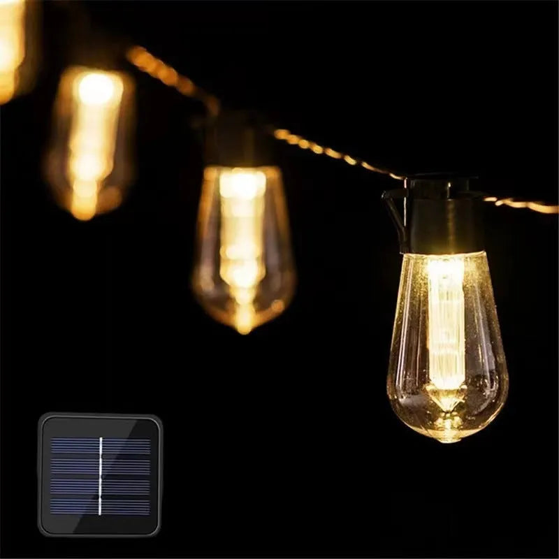 Retro solar outdoor string lights with infusion bottle shape bulbs in garden setting