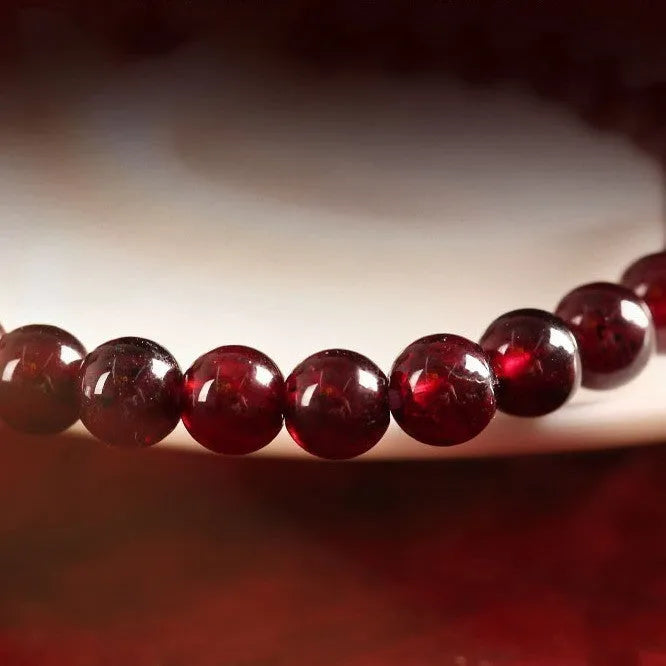 Chinese style gourd bracelet with imitation garnet beads and traditional Fu character charm on adjustable U-shaped design