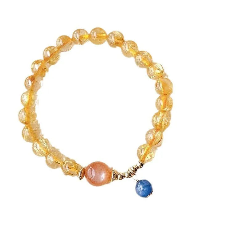 Gold rutilated quartz and sunstone bracelet with round diamond-cut beads for women