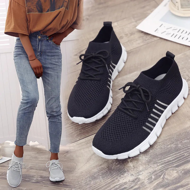 Breathable women's flying knit flat shoes in beige with mesh upper, round toe, low heel, and front tie closure.