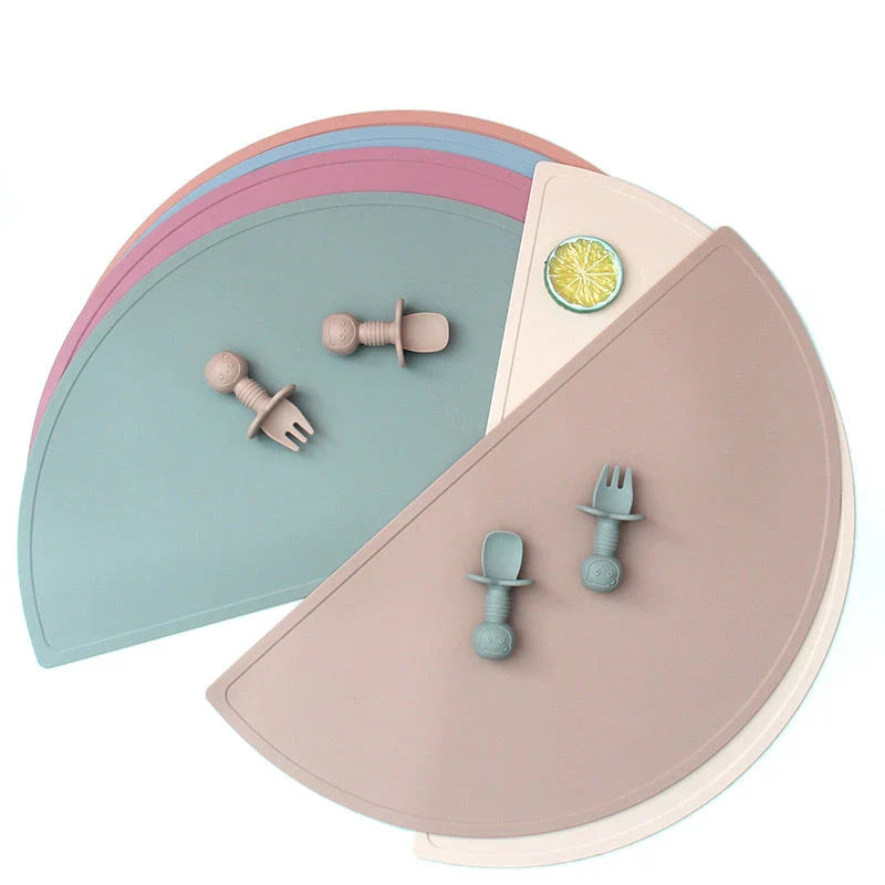 A durable, food-grade silicone placemat in various colours, suitable for Kiwi kids' mealtimes.