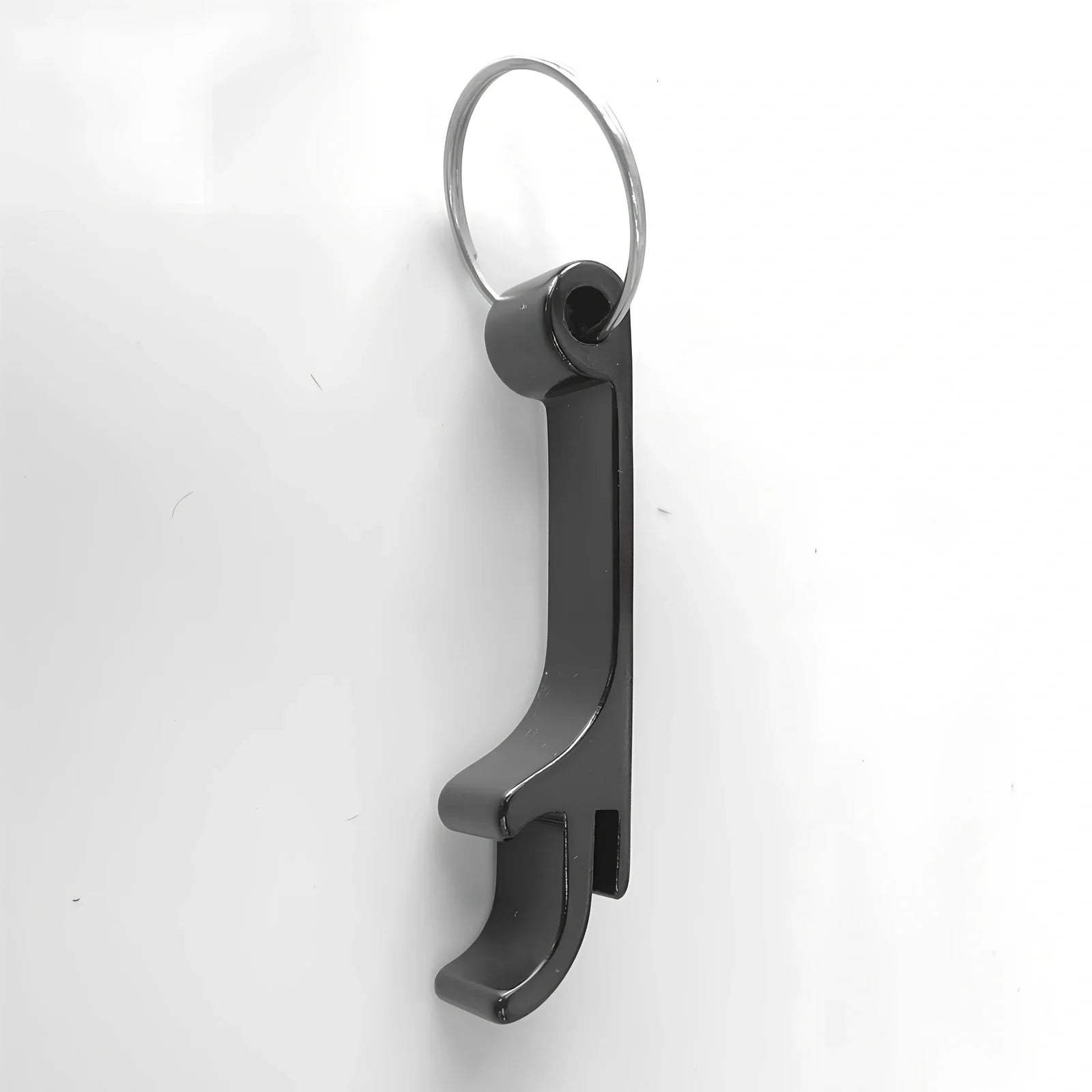 Black self-defence keychain set with alarm, bottle opener, and multiple protection tools