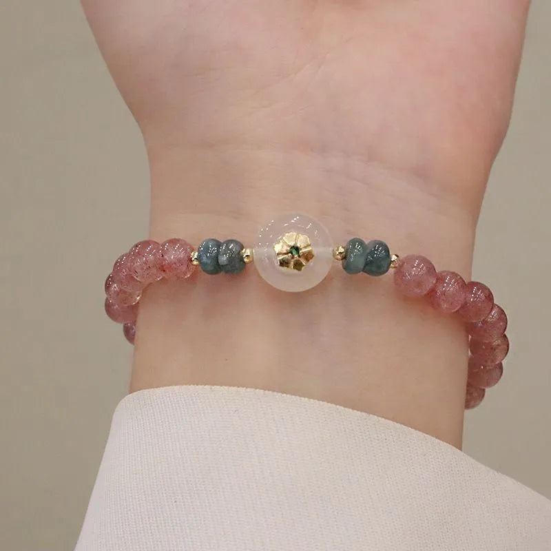 Women's strawberry quartz bracelet with blue water emerald stones and round jade pendant on geometric chain
