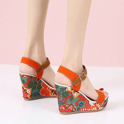 Women's floral embroidered wedge sandals in black, green, and orange with buckle strap