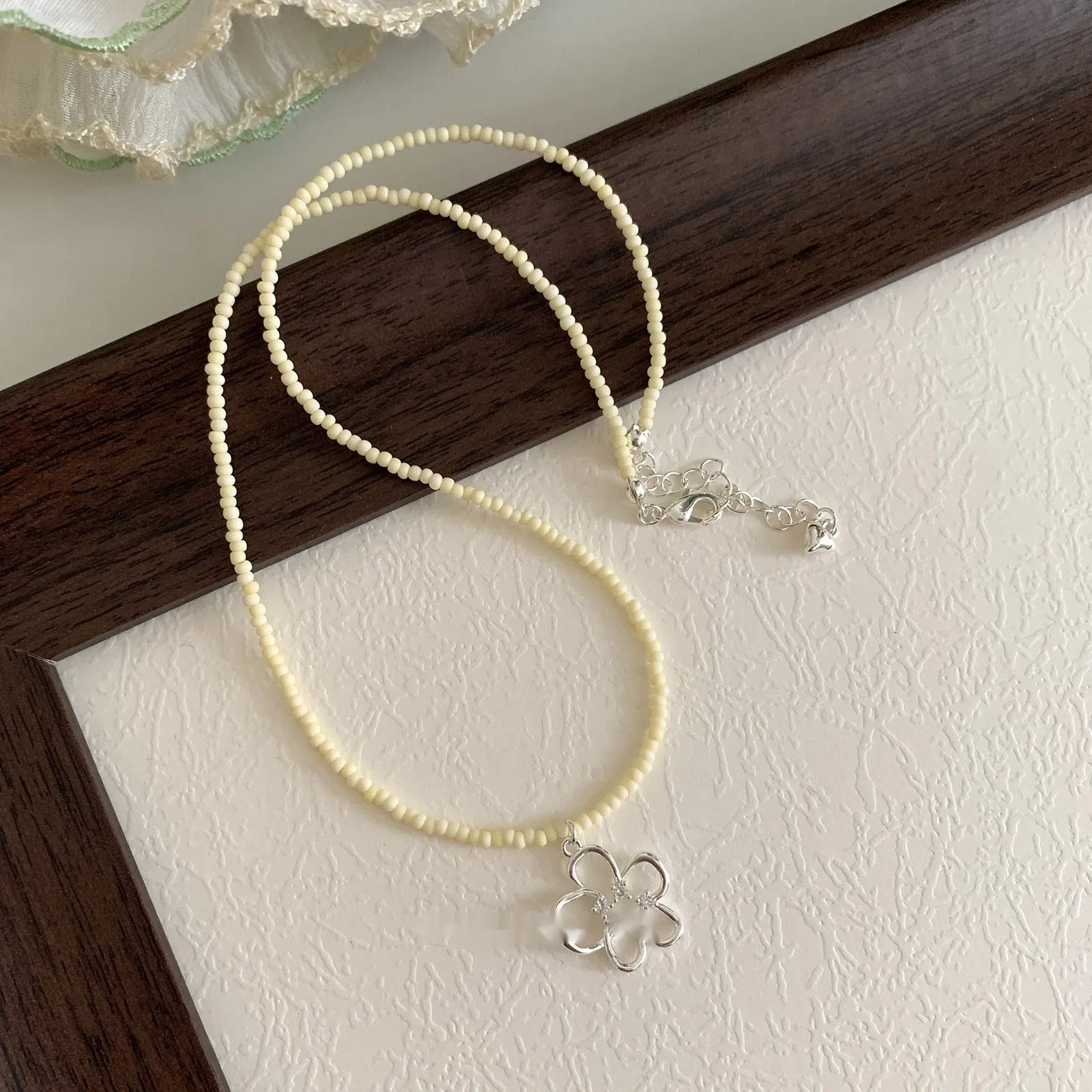 Women's U-shaped copper necklace with hollow flower pendant and colourful beaded decoration