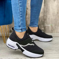 Women's closed toe low top sports shoes in patent leather with slingback design, round toe, and injection-moulded rubber sole