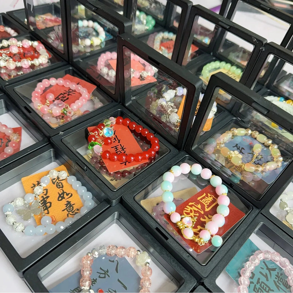 Coloured glaze Chinese bracelet with mixed materials in leaf, drop, and star shapes