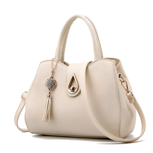 Women's litchi pattern PU leather tote bag with zipper closure and adjustable shoulder strap showing internal pockets