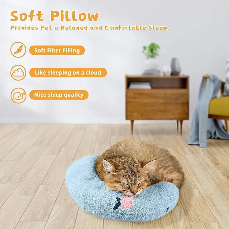 A small blue U-shaped plush pillow for a cat or small dog to sleep in.