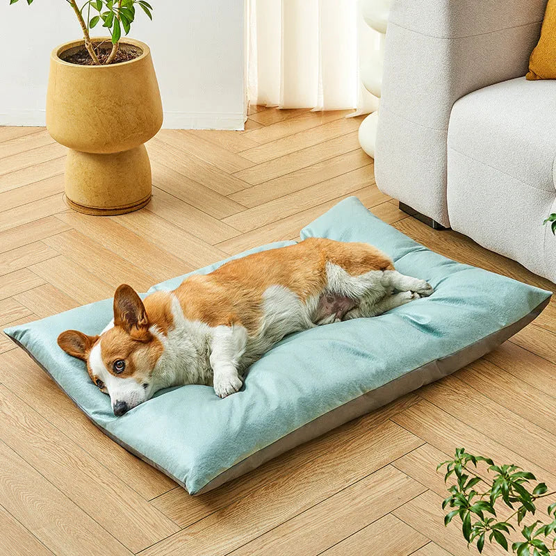 Blue pet bed sleeping mat for cats and small dogs in a nest style with raised edges.