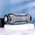 Small portable Bluetooth speaker in black showing front speaker grilles and control buttons