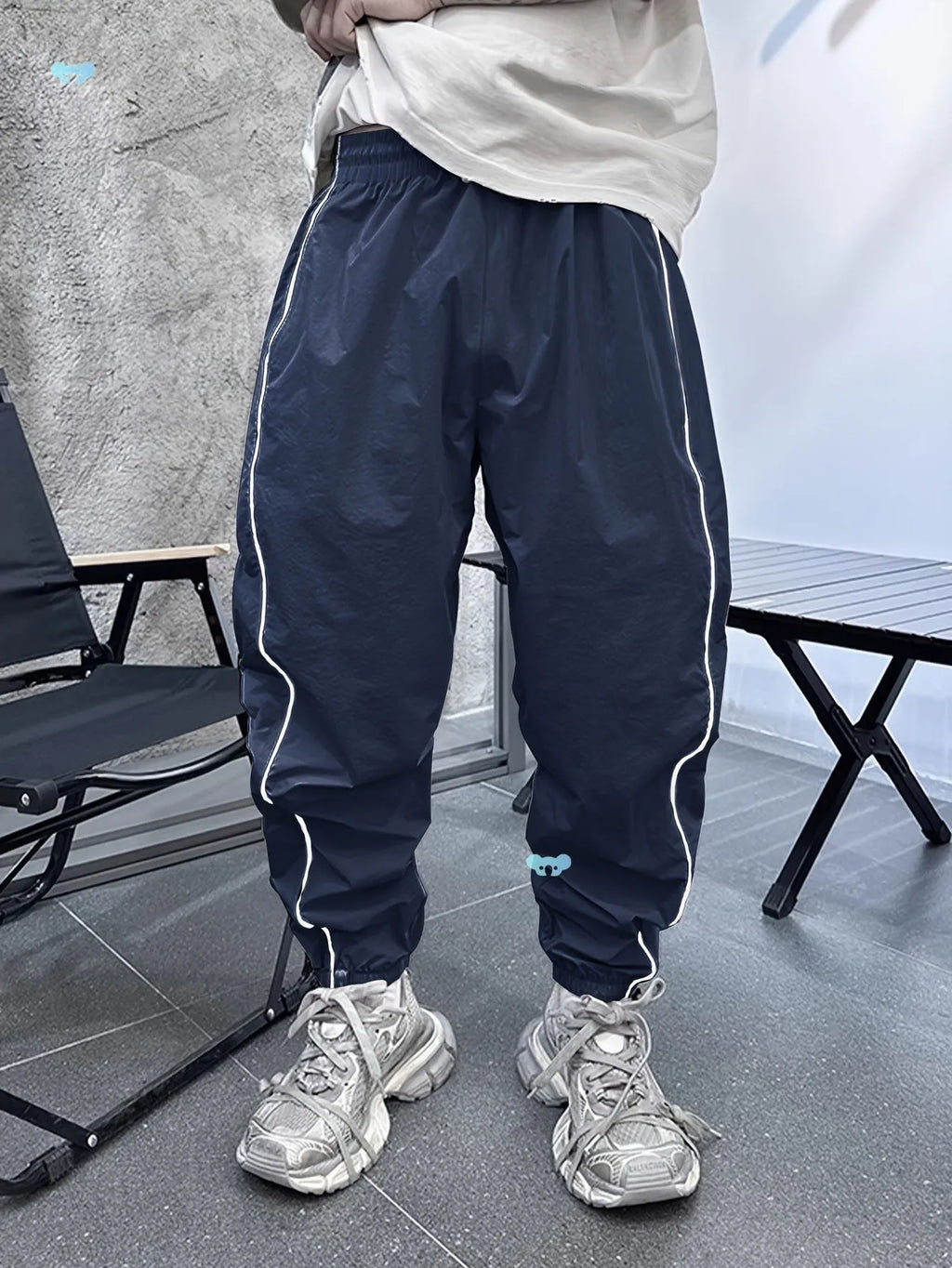 Men's loose fit cropped trousers in bamboo fibre, shown in army green colour.