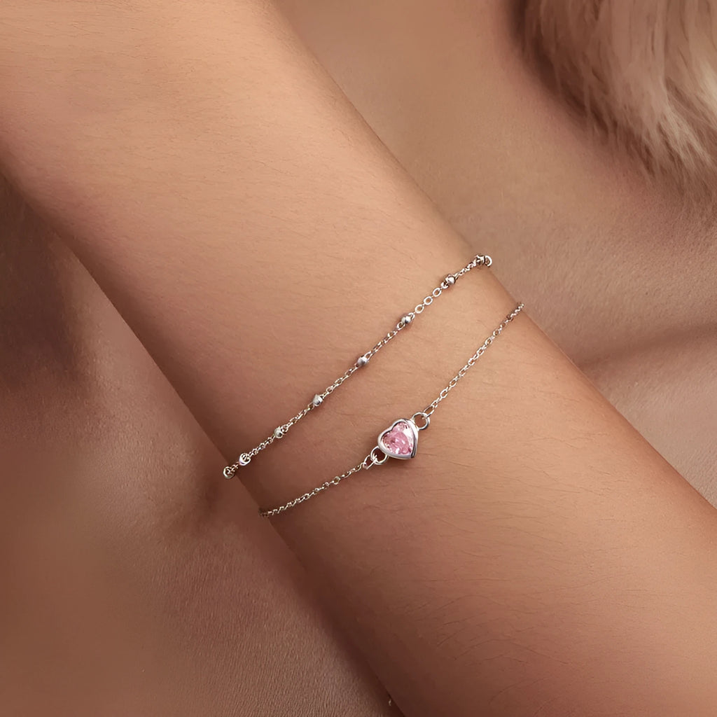 Women's sweet style sterling silver 925 bracelet with small heart-shaped charm on an adjustable chain.