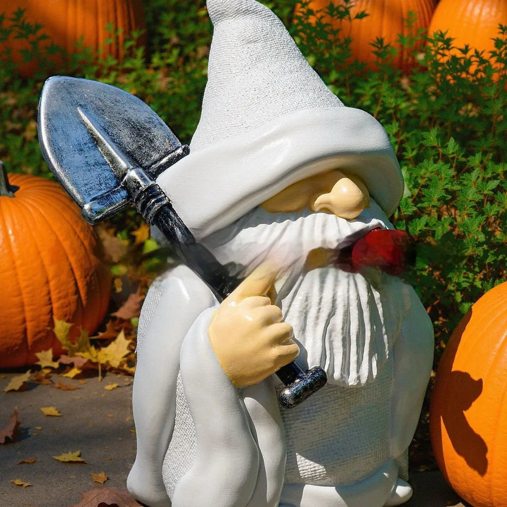 Resin Christmas ornament depicting dwarf character holding smoking pipe and shovel