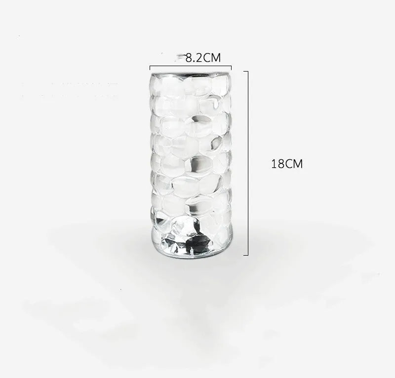 Crystal table lamp with teardrop acrylic shade showing droplet shadow effect on bedside table