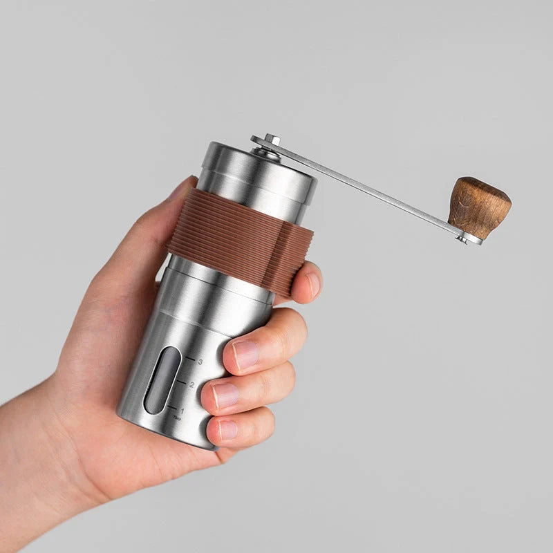 Portable hand coffee grinder with stainless steel body and non-slip silicone case