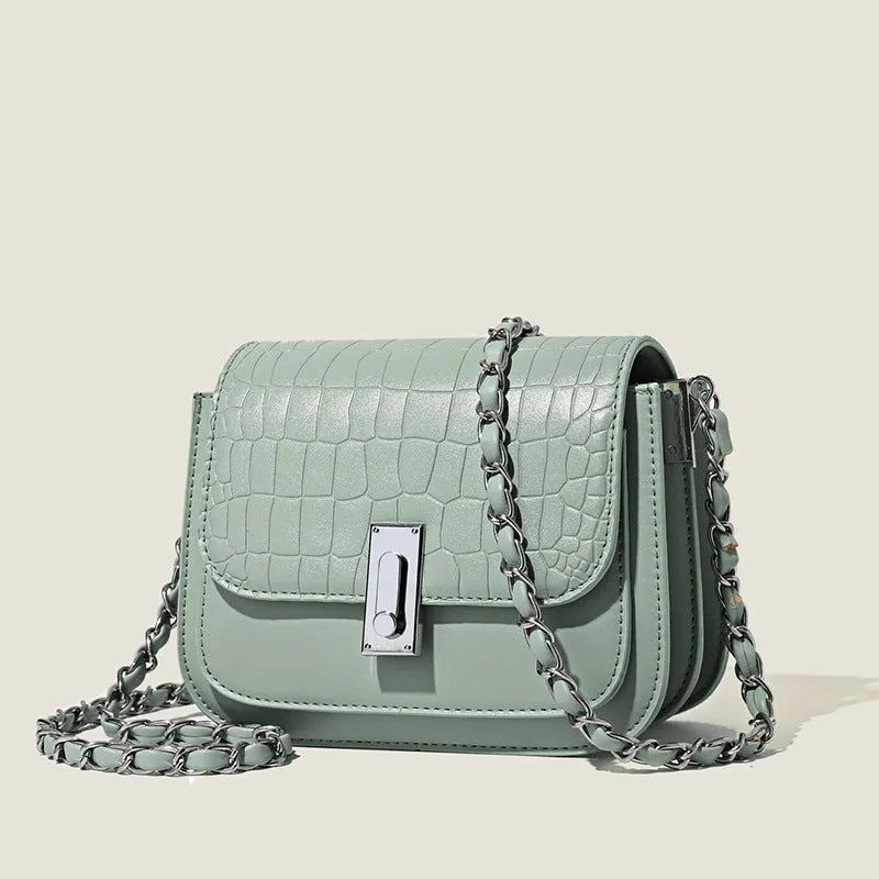 Soft black PU women's chain shoulder bag with sewing thread detail and a phone pocket.