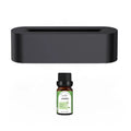 White square ultrasonic flame aroma diffuser with LED lights on a wooden table.