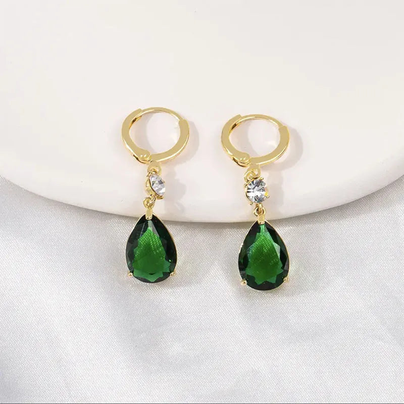 Green geometric teardrop clip-on earrings with gold plating.