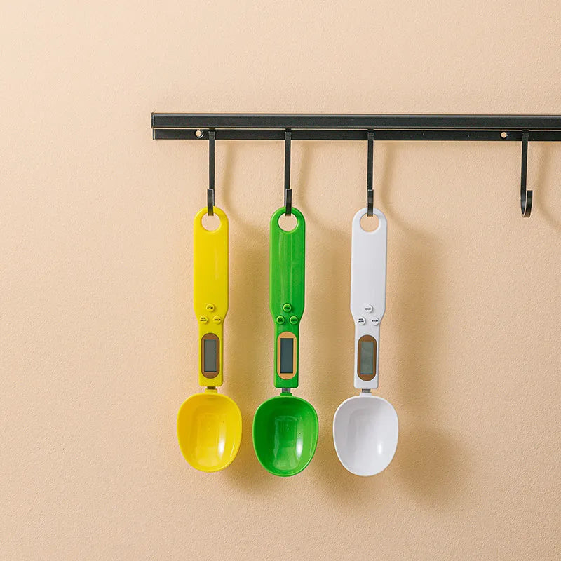 Digital spoon kitchen scale with LCD display showing weight measurement in grams