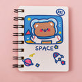 Astronaut themed pocket flipper notebook showing 10.5 by 8 cm dimensions with space cat cover design