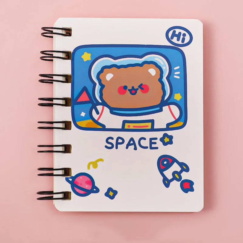 Astronaut themed pocket flipper notebook showing 10.5 by 8 cm dimensions with space cat cover design