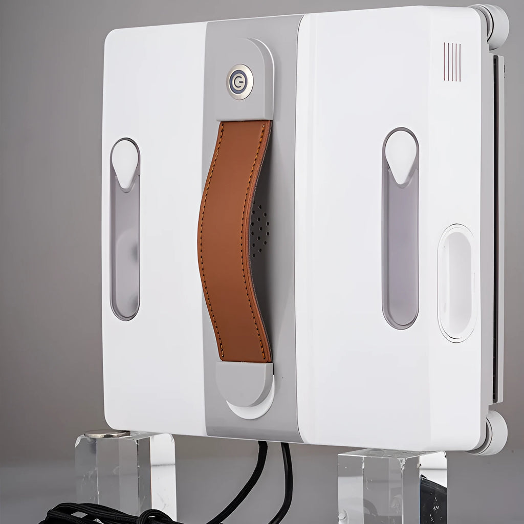 White square window cleaning robot with water spray nozzles on a glass window pane.