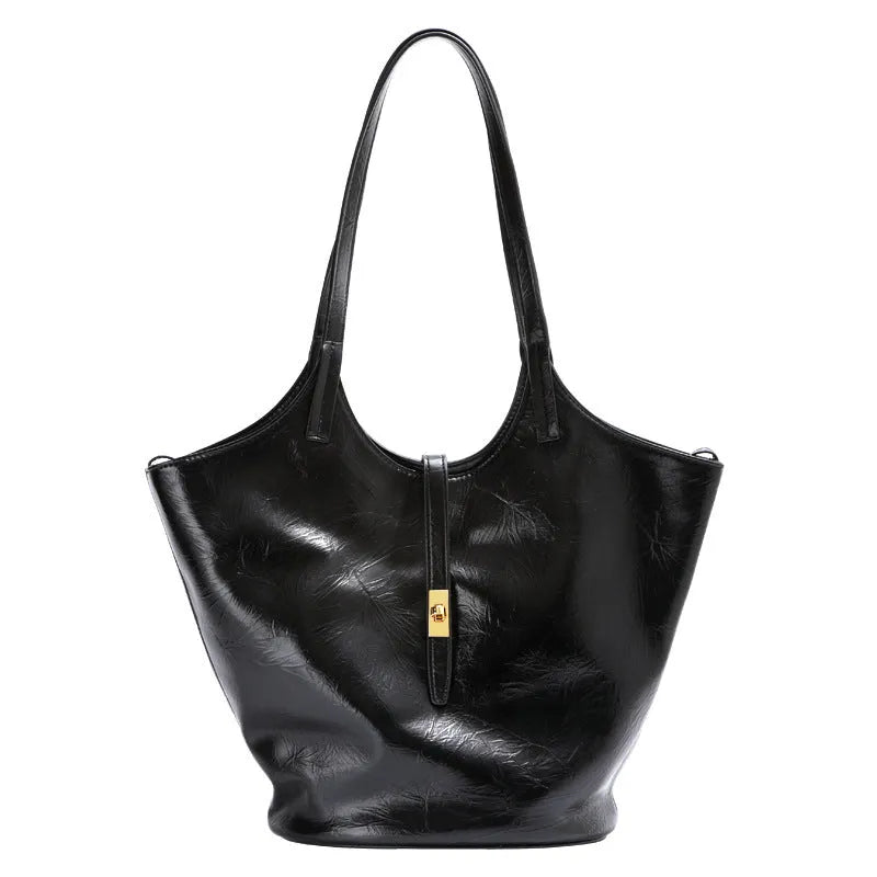 Black genuine leather bucket bag with sewing thread detail and single shoulder strap