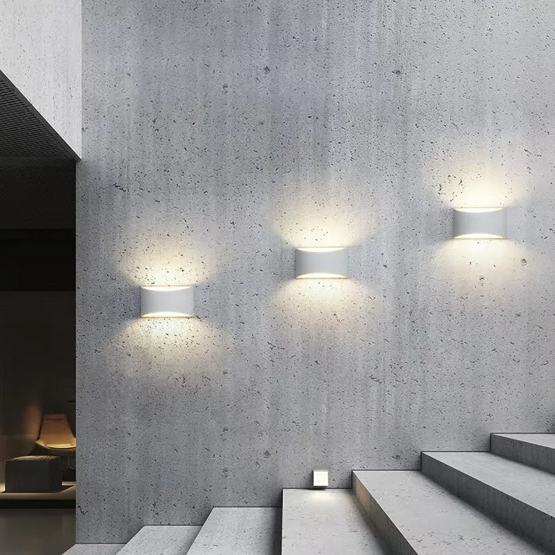 Simple Nordic plaster wall lamp with ABS shade mounted on a light-coloured wall