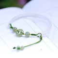 Hand-woven half bracelet with white agate and hetian jade beads and a peace buckle.
