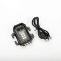 Black portable tactical mini warning flashlight with USB charging cable on a backpack strap.