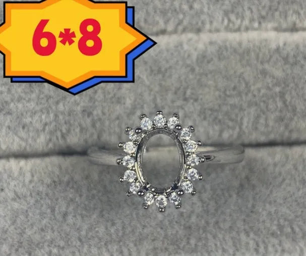 Oval denier ring with open mouth design showing 6*8mm main stone and five-pointed star decoration
