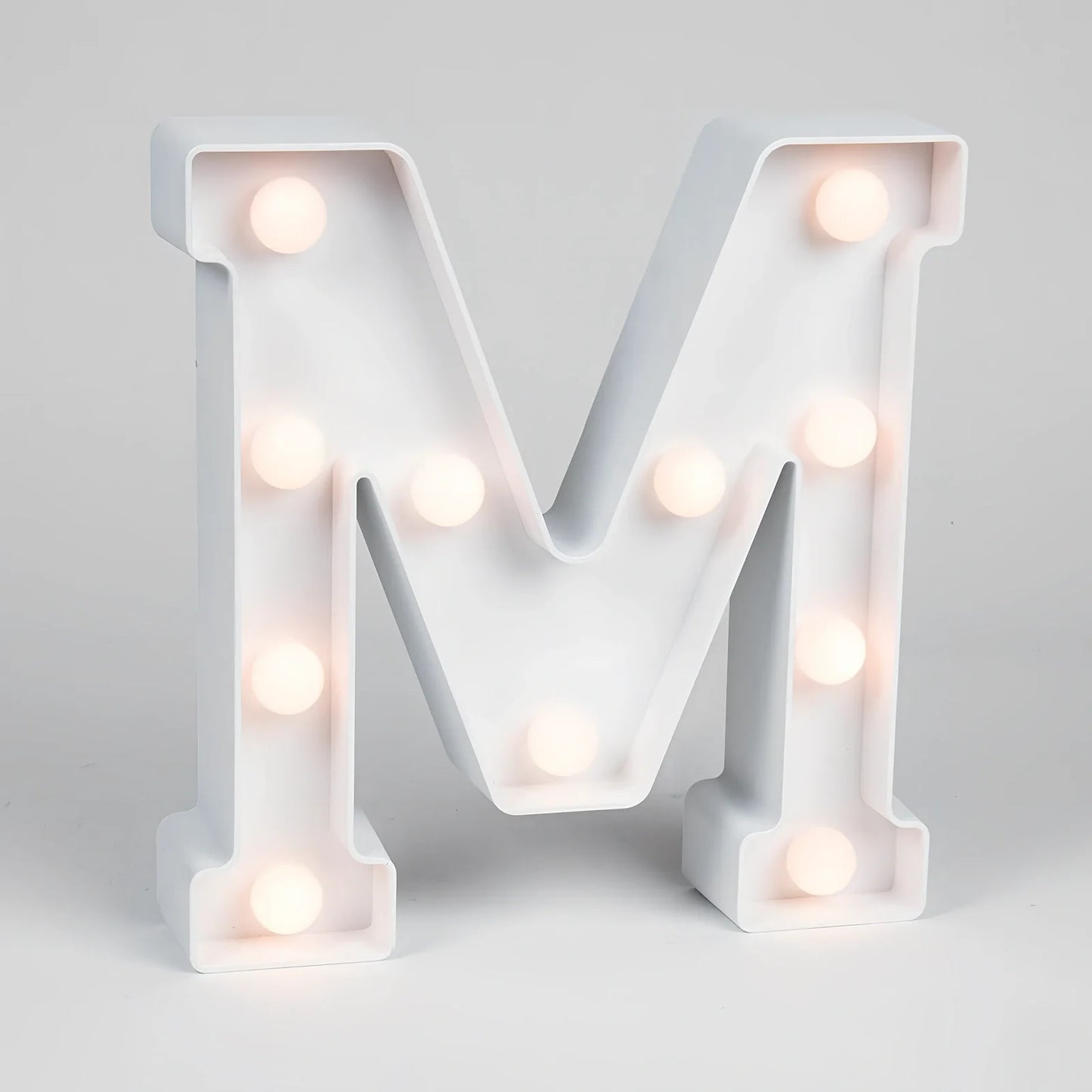 White plastic LED alphabet marquee sign with warm white illumination, 22cm height with battery operation