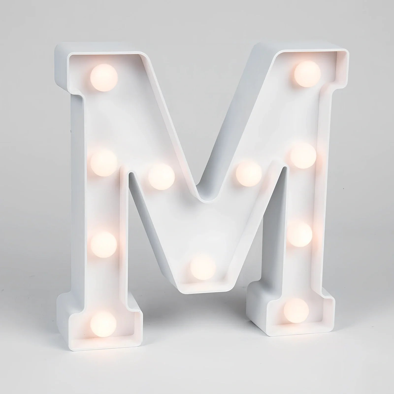 White plastic LED alphabet marquee sign with warm white illumination, 22cm height with battery operation