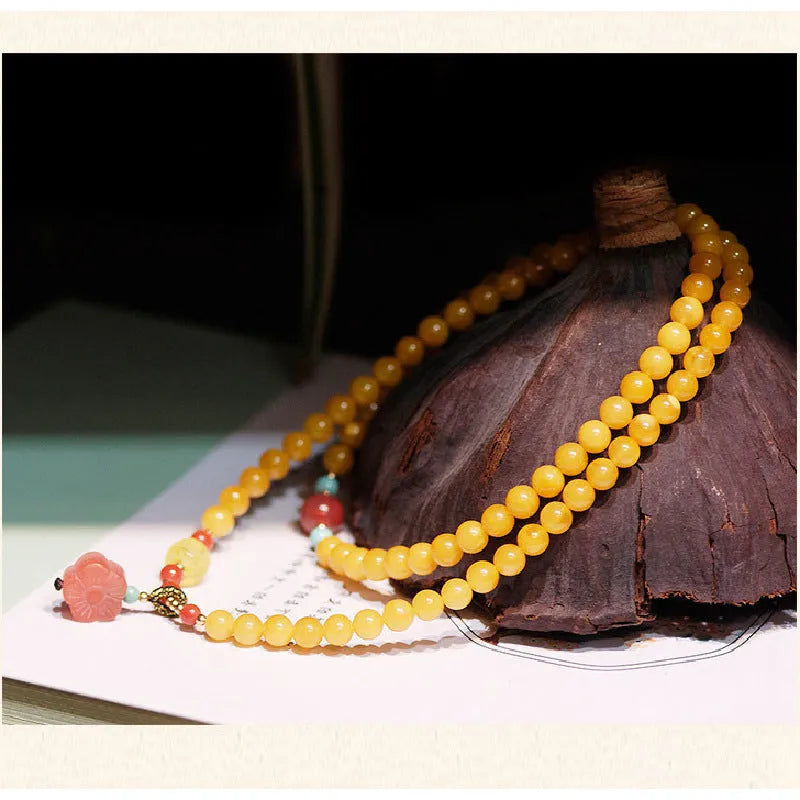 Yellow chicken grease beeswax amber bracelet with animal zodiac design and 5mm round retro styling