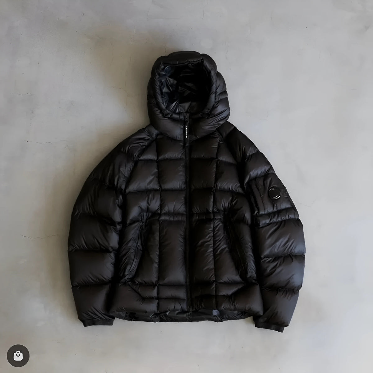 Men's winter hooded cotton coat in black with zippered pockets, plain front, and straight hem