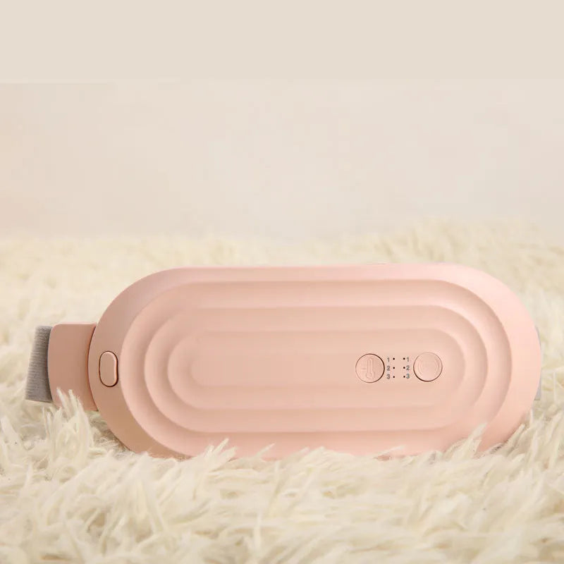 Pink electric heating and massage belt for waist and abdominal pain relief with digital controller.