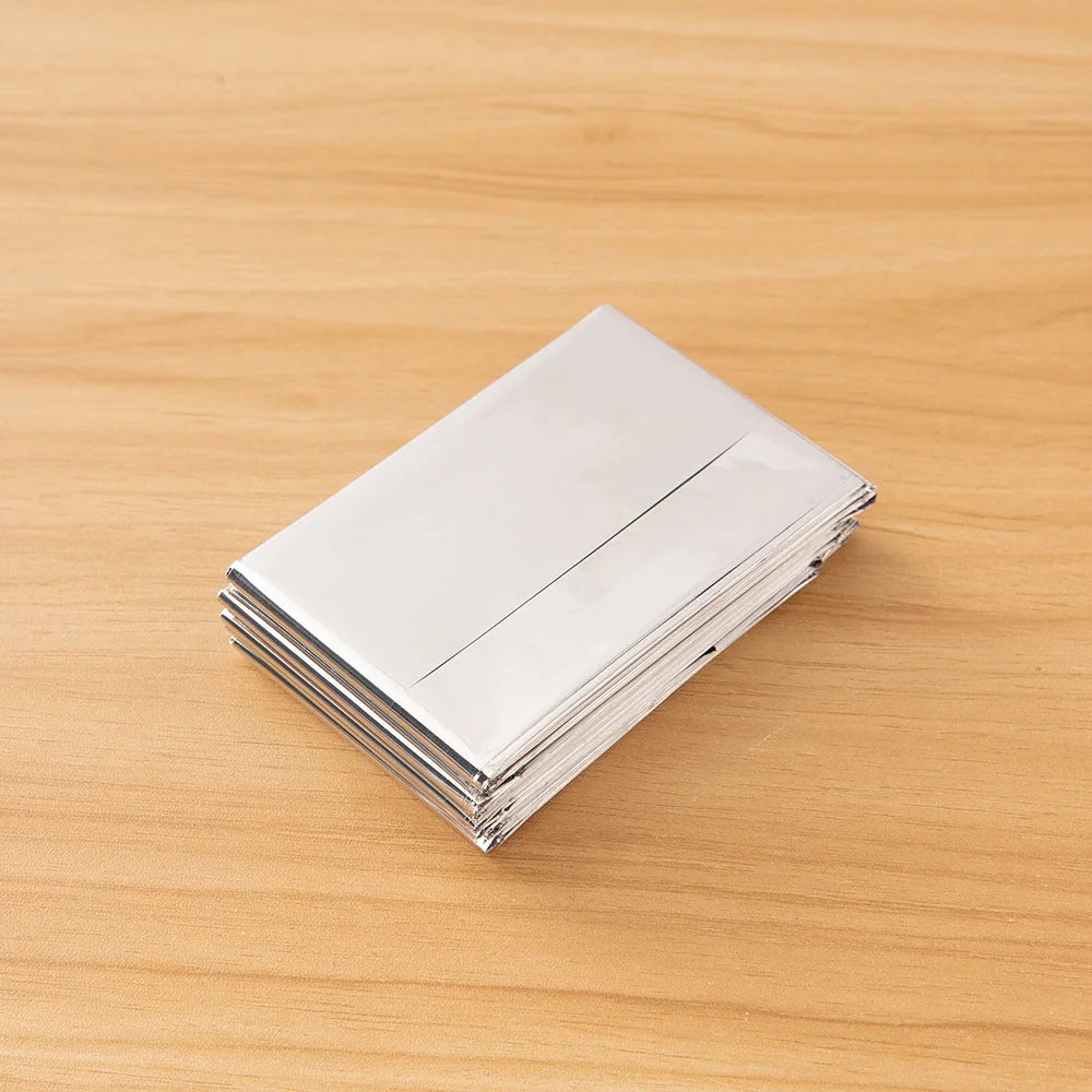 Double-sided silver and gold emergency thermal blanket for outdoor survival