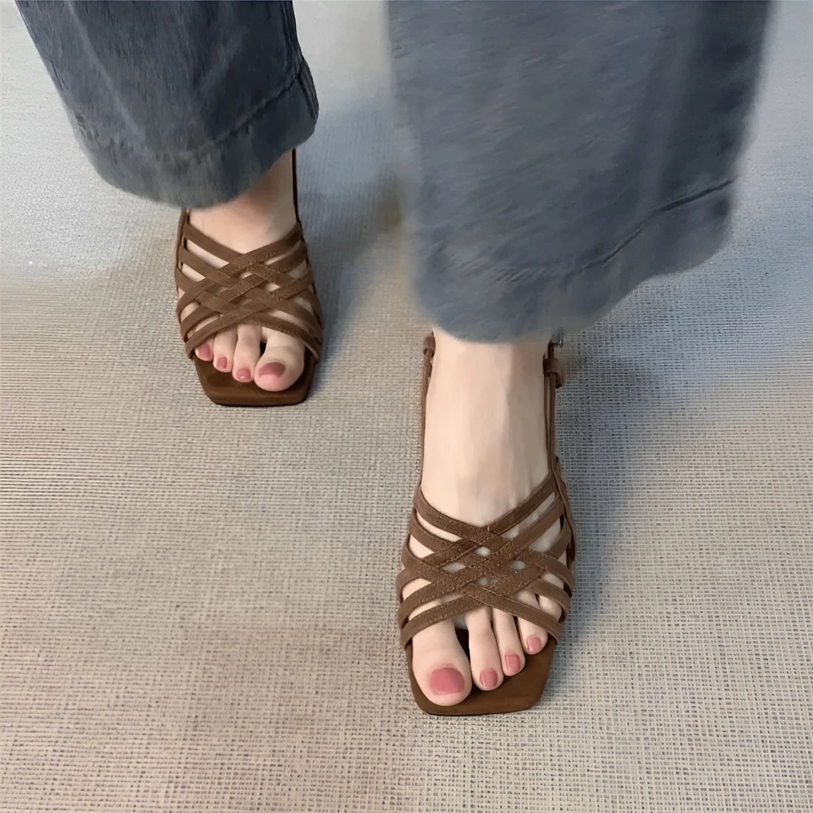 Retro-style women's high heel sandals with thin cross straps and an ankle buckle in light brown.