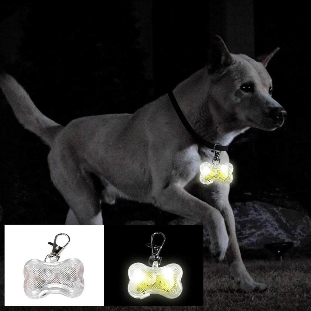 Bone-shaped LED luminous pendant for a pet collar showing blue light, next to two LR44 batteries.