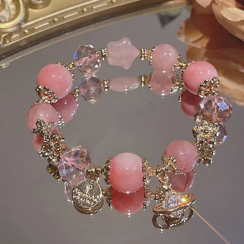 Women's galaxy colour bracelet with snowflake pendant and bow design elements